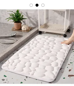 White pebble embossed memory foam bath mat for bathroom slip resistant floor decor detail