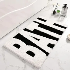 Tapis de bain mousse mémoire noir et blanc, tapis sol absorbant antidérapant pour salle de bain.