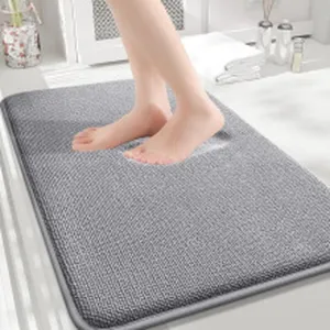 Detailed view of the soft gray bathroom floor mat with thick memory foam cushioning for cozy feet.