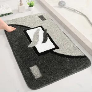 Tappeto da bagno assorbente trapuntato, zerbino antiscivolo con motivo geometrico dettaglio.