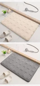 Soft memory foam bath mat with geometric square texture, absorbent and anti-slip detail shot.