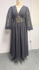 Detailed view of black lace V-neck long sleeve dress on mannequin with corset waist design.