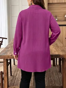Close-up detail of the purple vertical striped long-sleeve tunic shirt with lapel.