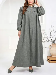 Close-up detail showcasing the elegant standing collar and button accents of the grey dress.