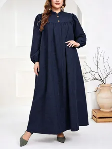 Detailed view of the long sleeve stand collar loose maxi dress with chic buttons and puff sleeves.