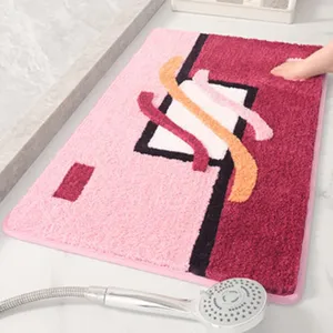 Tappetino da bagno in peluche assorbente e antiscivolo con motivo geometrico rosa