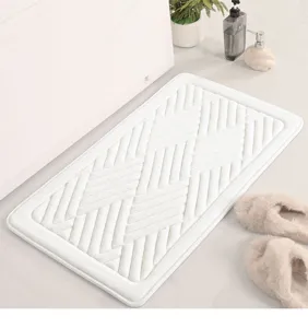White coral fleece embossed memory foam bath mat, anti-slip absorbent floor rug for home.