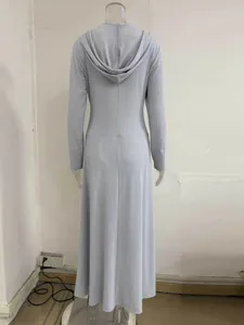 Back view of grey ribbed long sleeve hooded dress showing rear hoodie and floor length design.