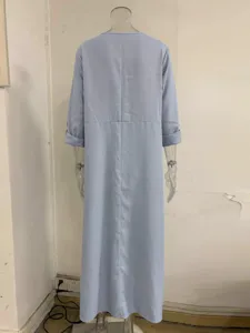 Back detail of light blue long sleeve maxi dress, casual loose fit design for daily wear.