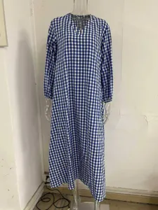 Blue and white gingham check pattern detail view of the long sleeve V-neck dress.