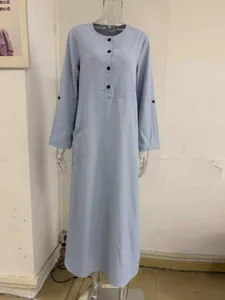 Light blue long sleeve casual maxi dress with button front, pockets and roll-up sleeves.