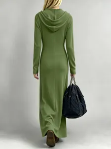 Detail view of the green ribbed long-sleeve hooded maxi dress, showcasing fit and texture.