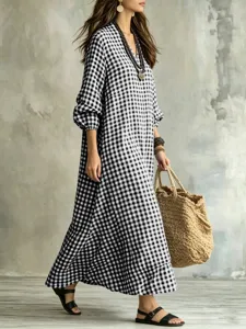 Casual black and white gingham maxi dress, V-neck, long sleeves, loose fit, detail view.