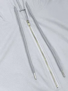 Close-up view showing the ribbed texture, metal half-zipper, and drawstring hood details.