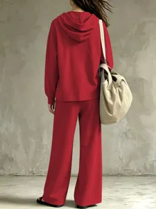 Red women loungewear set featuring a cozy hooded sweatshirt and matching stylish wide-leg pants.