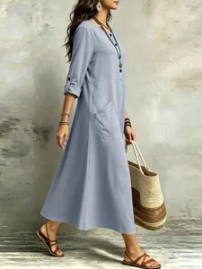 Detailed view of casual long sleeve midi dress with pockets in soft blue for daily wear styling.