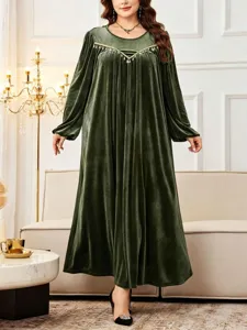 Plus size dark green velvet long sleeve maxi dress with elegant neckline trim detail.