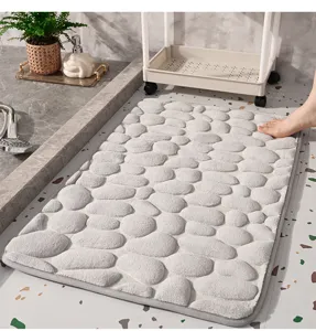 Memory foam bath mat with embossed pebble design, soft absorbent non-slip floor mat for bathroom.