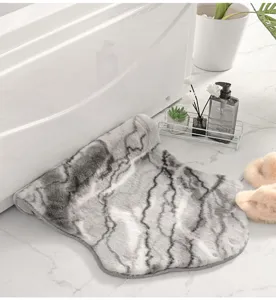 Grey imitation rabbit fur rug detail, soft fluffy floor mat for bedroom bedside or living room.