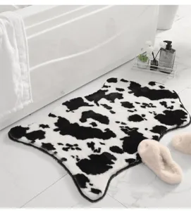 Faux rabbit fur cow print rug detail, soft plush surface and anti-slip backing for floor.