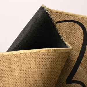 Non-slip entrance floor mat with soft linen printed surface and durable stitched edges for home.