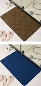 Thickened coral velvet bath mat with geometric quatrefoil pattern, soft and absorbent.