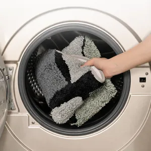 Flocked geometric non-slip door mat displayed inside washing machine for bathroom use