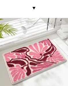 Plush absorbent bath mat with elegant pink floral pattern, thick non-slip floor rug for home.