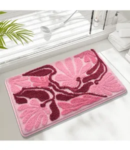 Detailed view of the thick plush floral bath mat, soft tufted surface with non-slip backing.