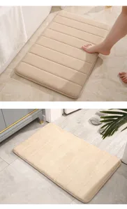 Thickened memory foam bath mat, soft plush surface with striped design, anti-slip backing.