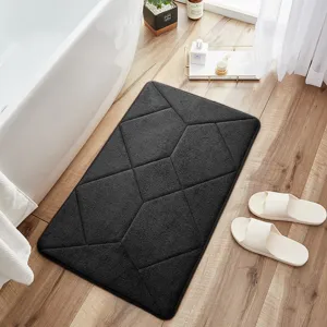 Dark grey memory foam bath mat with geometric pattern, soft absorbent shower rug for home.