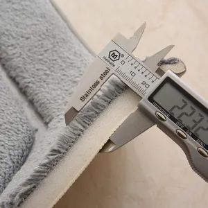 Thick grey non-slip bathroom floor mat close up showing plush surface texture and sponge layer depth.