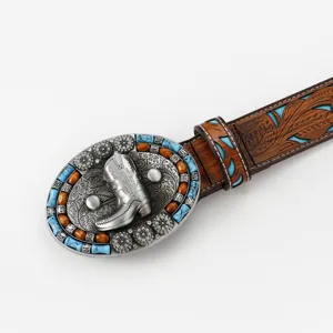 Western vintage leather belt featuring ornate cowboy boot metal buckle and turquoise beads.