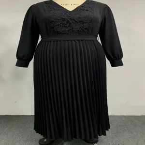 Plus size black long sleeve dress with lace V-neck, waist tie and pleated skirt for women.