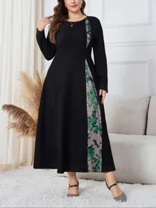 Plus size black long sleeve dress with floral panel, elegant and comfortable daily wear.