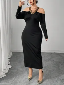 Elegant black off-shoulder long sleeve midi dress featuring sparkling sequin neckline trim.