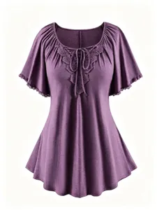 Plus size purple short sleeve top with delicate lace trim, bow tie neckline, and flare hem.