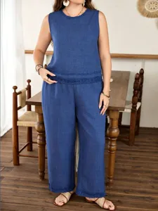 Blue sleeveless top and wide-leg trousers set, detail view of casual summer outfit.