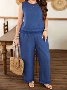 Blue sleeveless top and wide-leg pants set detail view, showing elegant lace trim.