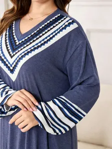 Close-up view of the V-neck geometric print long sleeve plus-size casual dress detail.