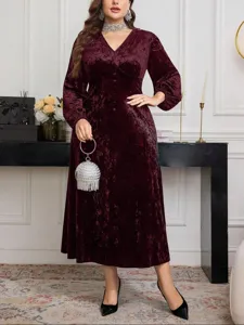 Burgundy velvet plus size long sleeve V-neck dress detailed features and elegant style.