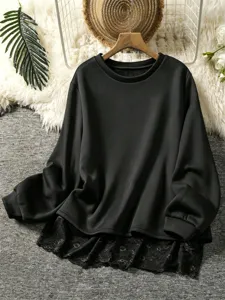 Detail shot of stylish black long sleeve sweatshirt featuring elegant lace hem and cozy design.