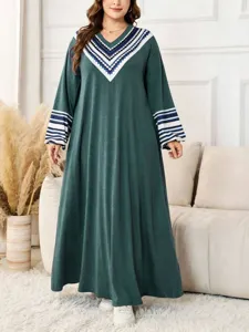 Details of the women autumn V-neck geometric print trumpet sleeve loose plus size long dress.