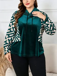 Plus size velvet hoodie for women with geometric contrast long sleeves, cozy and elegant.