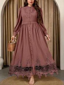 Detailed view of long sleeve maxi dress with elegant lace embroidery and belt design.