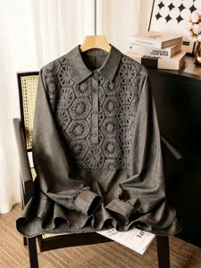 Detailed view of dark grey long sleeve blouse with elegant crochet lace panel and lapel collar.