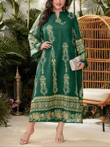 Plus size long sleeve green maxi dress featuring elegant gold print patterns for casual wear.