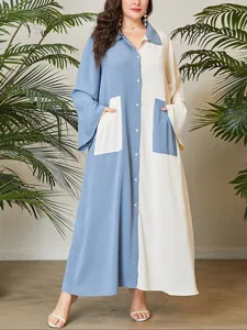 Close-up detail of the plus-size color-block maxi dress featuring chic lapel and button closure.