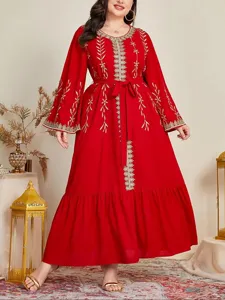Plus size red long sleeve maxi dress featuring elegant gold embroidery details and waist tie.