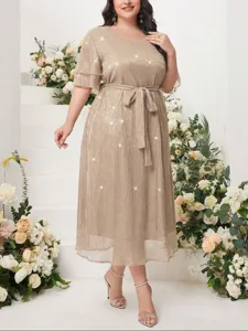 Plus size elegant shimmering midi dress featuring tiered sleeves and matching waist belt detail.